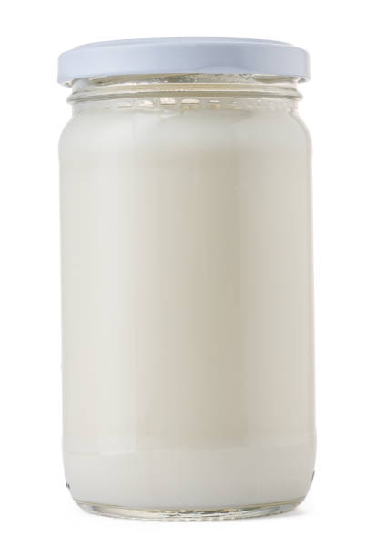 istock Glassware full of fresh milk isolated on white 1282257274