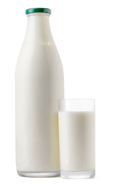 istock Glass bottle and cup of fresh milk isolated 1282257806