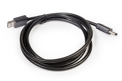 DisplayPort cable with full-size connectors for connect computer to monitor is twisted and tied in a ring on a white background