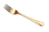 Gold fork on a white background. Cutlery.