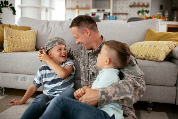 istock Soldier enjoying at home with children. 1282258290