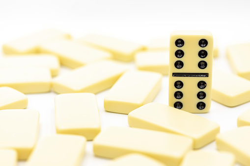 Success concept of dominoes standing out from the crowd