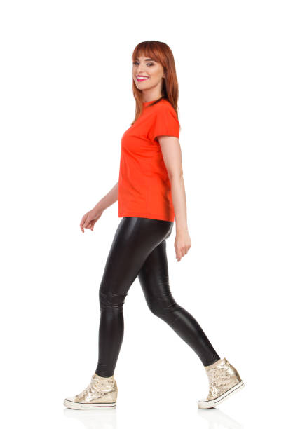 istock Smiling Young Woman Is Walking And Looking At Camera 1282261879