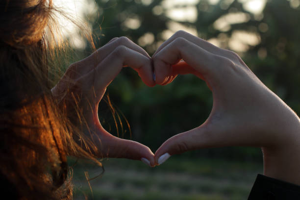 istock Hands making love heart sign gesture. Spread love concept. 1282263921