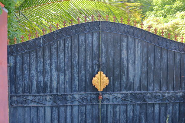 istock View of locked old iron gate for farm safety 1282264554