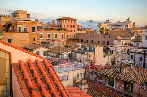 Rome, Italy -- A sunset view from the rooftops of the iconic roman Pantheon quarter, in the heart of Rome. At left the white Vittoriano or Altare della Patria, the Italian National Monument. Image un High Definition Format.