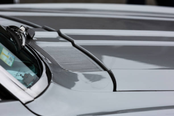 istock Gray bonnet, glass windshield and windshield wiper of a classic car 1282268783