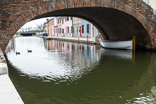 Comacchio, often described as 'Little Venice', is known for its canals, small pedestrian bridges and cosy houses.