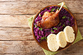 Delicious, yet simple Bohemian style duck pecena kachna close-up in a plate. horizontal top view