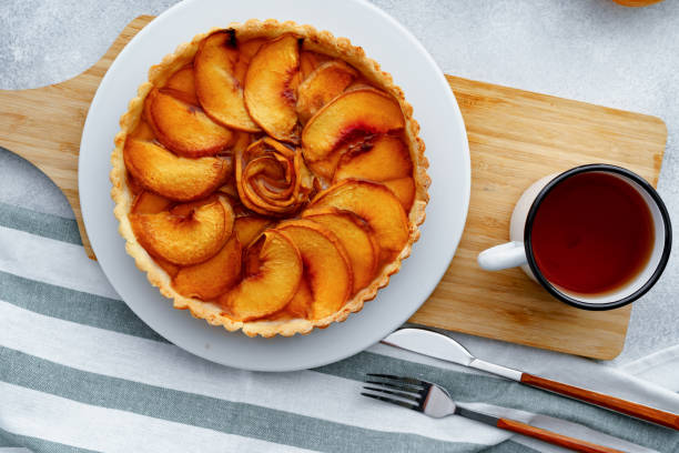 istock Top view of apple pie on wooden board 1282270496