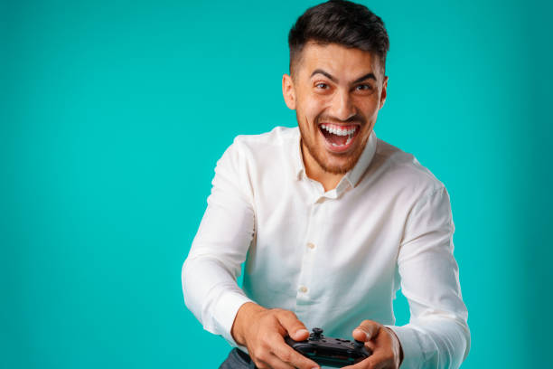 istock Handsome mixed-race man holding video games joystick 1282271777