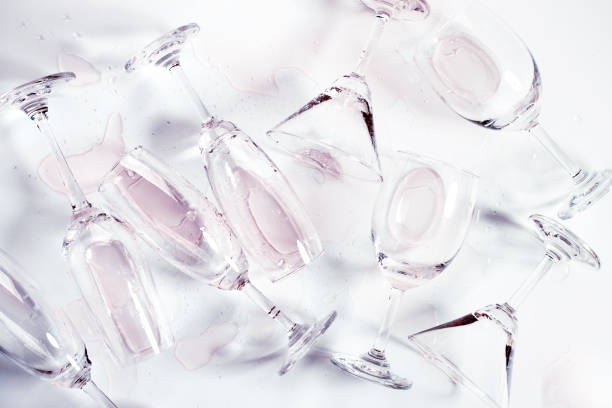istock Glasses of champagne and alcohol drinks on white table background 1282272481