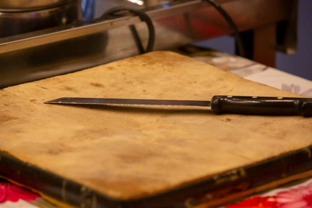 istock knife on wooden cutting board 1282274306