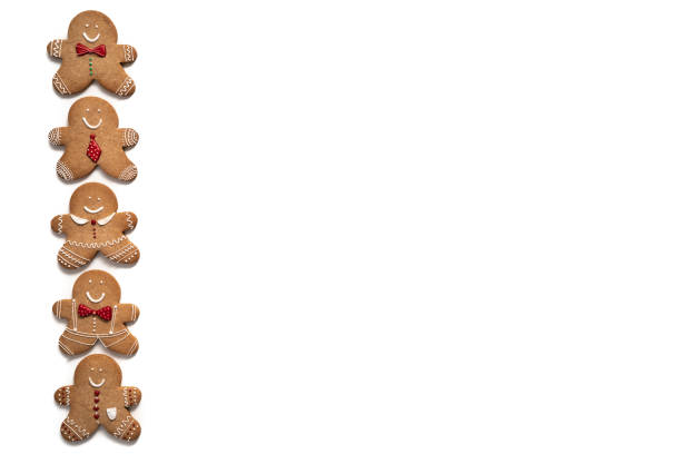 istock Christmas gingerbread men cookies five in a row isolated on white 1282274507