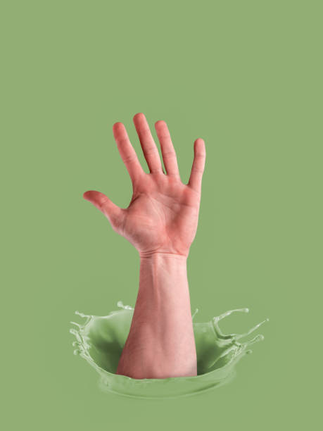 istock Ink splashes. Pastel green paint. Male hand in paint. Voting concept. 1282277109