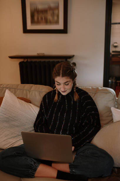 istock Young woman working form home with a laptop computer 1282277922
