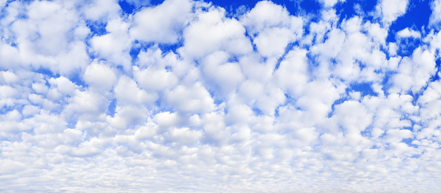 White cumulus clouds on blue sky background, beautiful cirrus cloudscape wide panoramic view, cloudy skies panorama, fluffy cloud texture, sunny heaven landscape, cloudiness weather backdrop, overcast