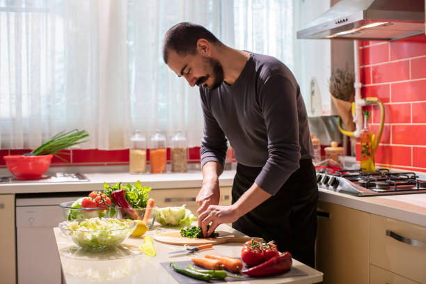 istock Man Cutting Fresh Parsley  at the Kitchen 1282278387