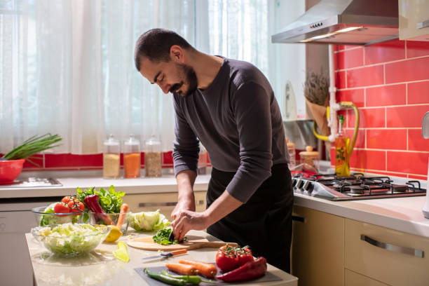 istock Man Cutting Fresh Parsley  at the Kitchen 1282278462