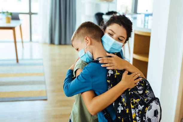 istock Woman hugging her young son before he leaves for school 1282282356