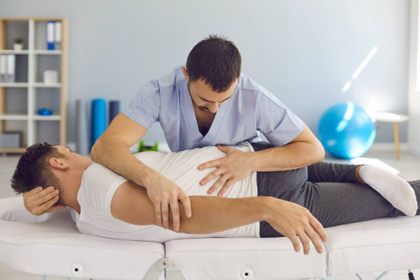 istock Chiropractor, osteopath, physiotherapist or manual therapist working with male patient 1282282487