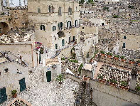 The Sassi of Matera in Matera, Italy. The Sassi of Matera are two district, Sasso Caveoso and Sasso Barisano, of the italian city of Matera, Basilicata, known for their ancient cave dwellings inhabited since the Paleolithic period.