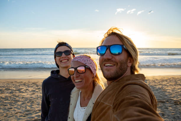 istock Happy friends taking selfie at Santa Monica beach 1282284436
