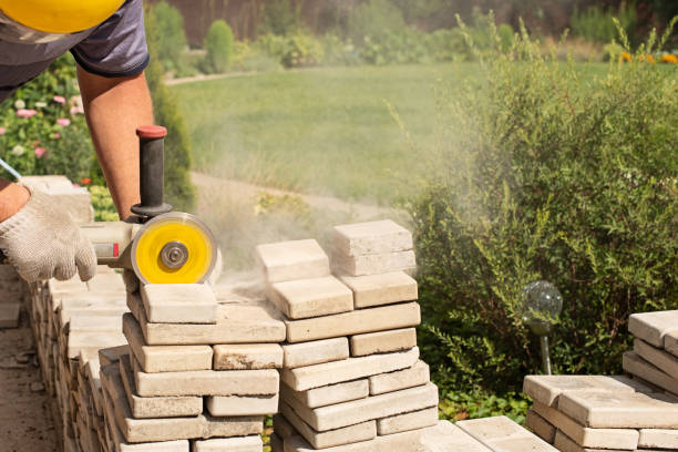 istock Master saws paving slabs with a grinder grinder. Dust 1282284658