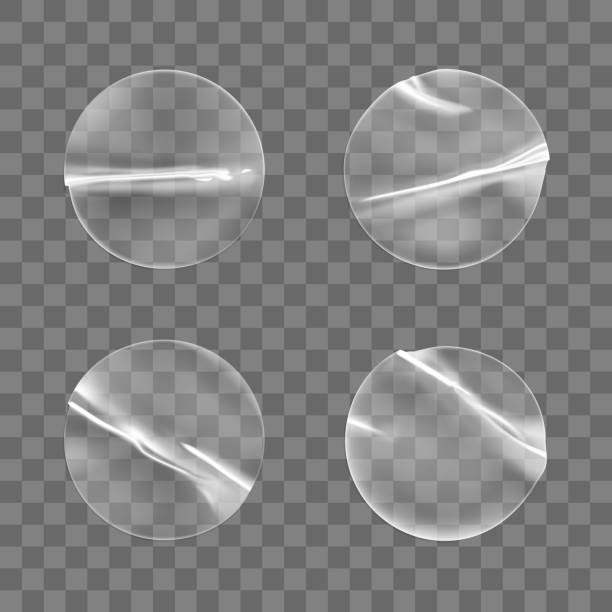 istock Transparent round adhesive stickers mock up set isolated on transparent background. Plastic crumpled round sticky label with glued effect. Template of a label or price tags. 3d realistic vector mockup 1282284700