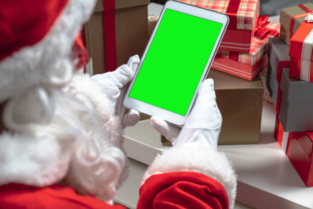 istock Over Shoulder View Of Santa Claus Having Video Call 1282287569
