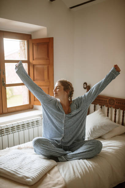 istock Young woman waking up in the morning 1282287667