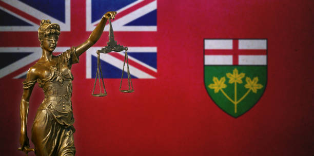 istock Lady Justice before a flag of Ontario 1282288365