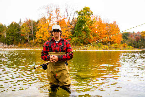 istock A young fly fisherman in a river during the fall. 1282288978