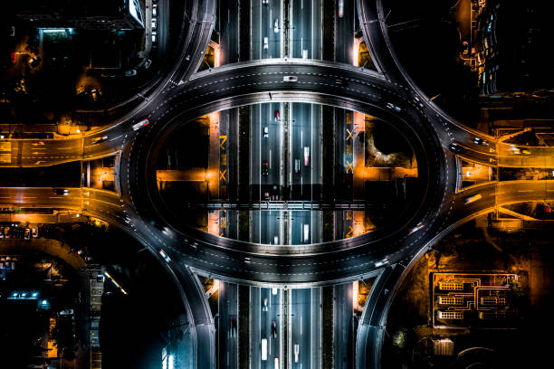 highway beneath the circle road seen from a drone point of view - traffic roundabout imagens e fotografias de stock