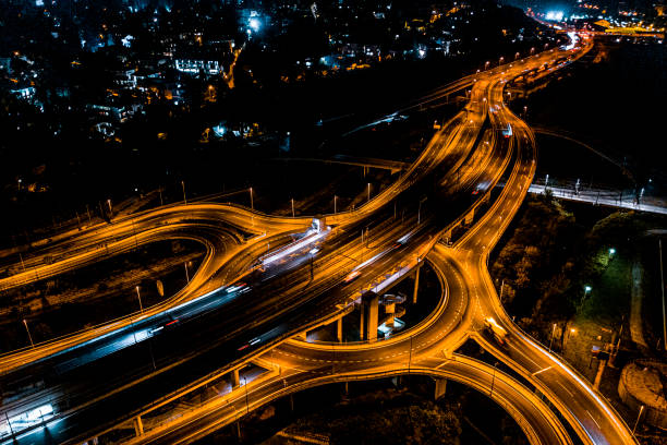 istock Empty city circle road intersection see from a drone point of view at night 1282290052