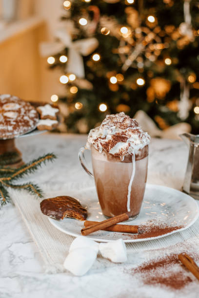 istock Cozy Christmas Hot Chocolate with marshmallowss, cookies and christmas tree 1282290362