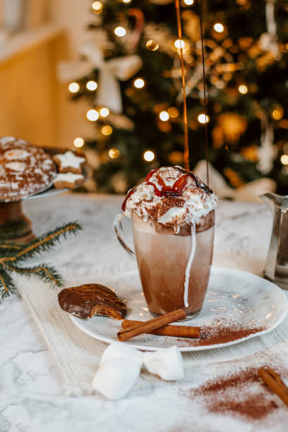 istock Cozy Christmas Hot Chocolate with marshmallows, cookies and christmas tree 1282290363