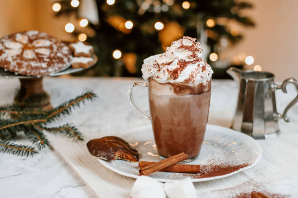 istock Cozy Christmas Hot Chocolate with marshmallowss, cookies and christmas tree 1282290366