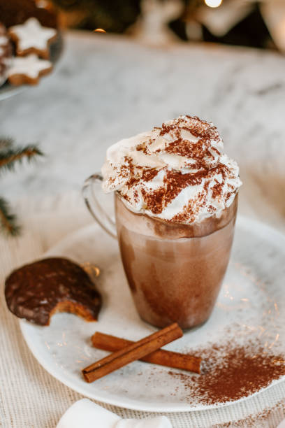 istock Cozy Christmas Hot Chocolate with marshmallowss, cookies and christmas tree 1282290372
