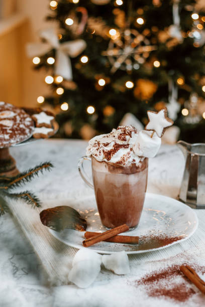 istock Cozy Christmas Hot Chocolate with marshmallowss, cookies and christmas tree 1282290390