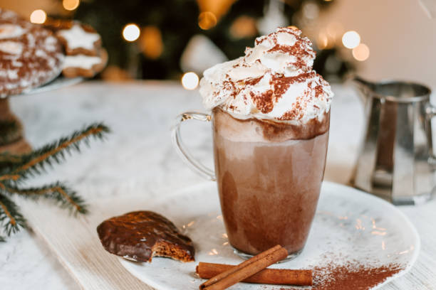 istock Cozy Christmas Hot Chocolate with marshmallowss, cookies and christmas tree 1282290394