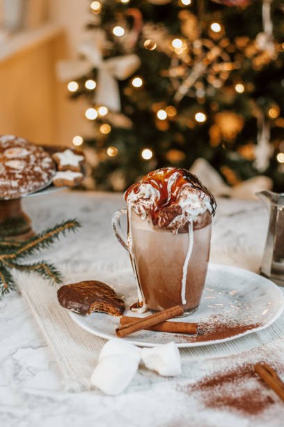 istock Cozy Christmas Hot Chocolate with marshmallows, cookies and christmas tree 1282290407