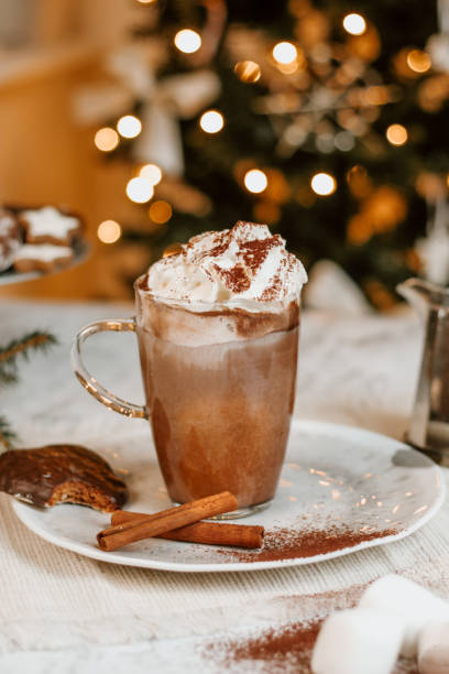 istock Cozy Christmas Hot Chocolate with marshmallowss, cookies and christmas tree 1282290975