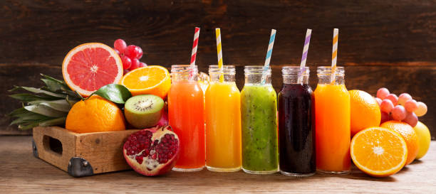 istock bottles of fruit juice with fresh fruits 1282291131