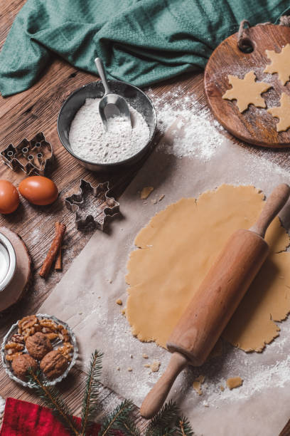 istock Baking homemade Christmas cookies on rustic wood table 1282291203