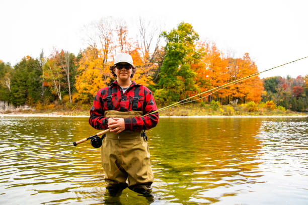 istock A young fly fisherman in a river during the fall. 1282291346