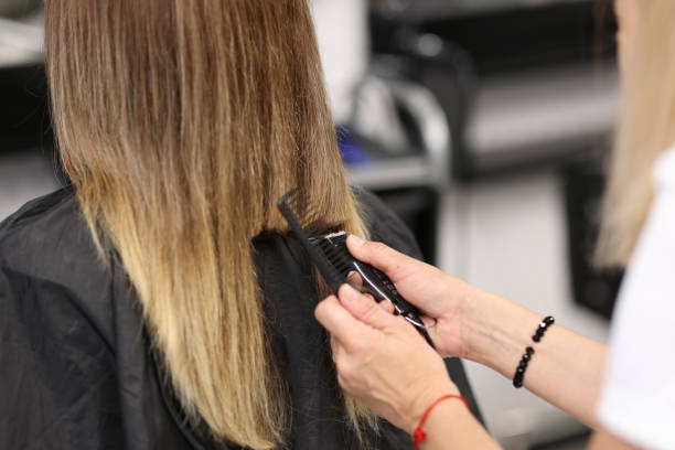 istock Woman holds hair clipper in her hands 1282291580