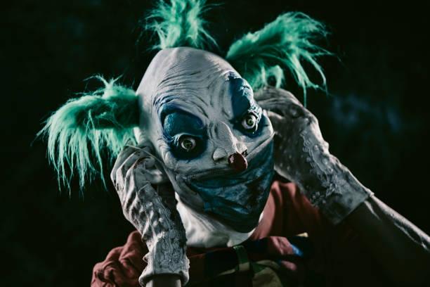 istock disturbing evil clown wearing a face mask 1282291597