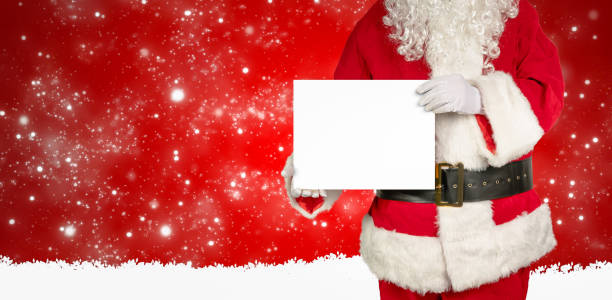 istock santa holds an empty white panel for advertising in the camera 1282294218