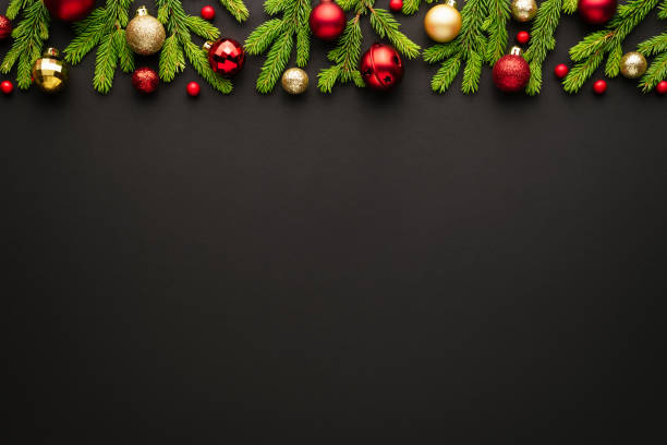 istock Black christmas background with ornate frame of christmas tree decorations 1282294532